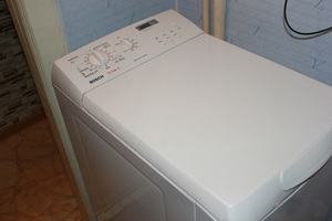 Стиральная машина Бош с вертикальной загрузкой